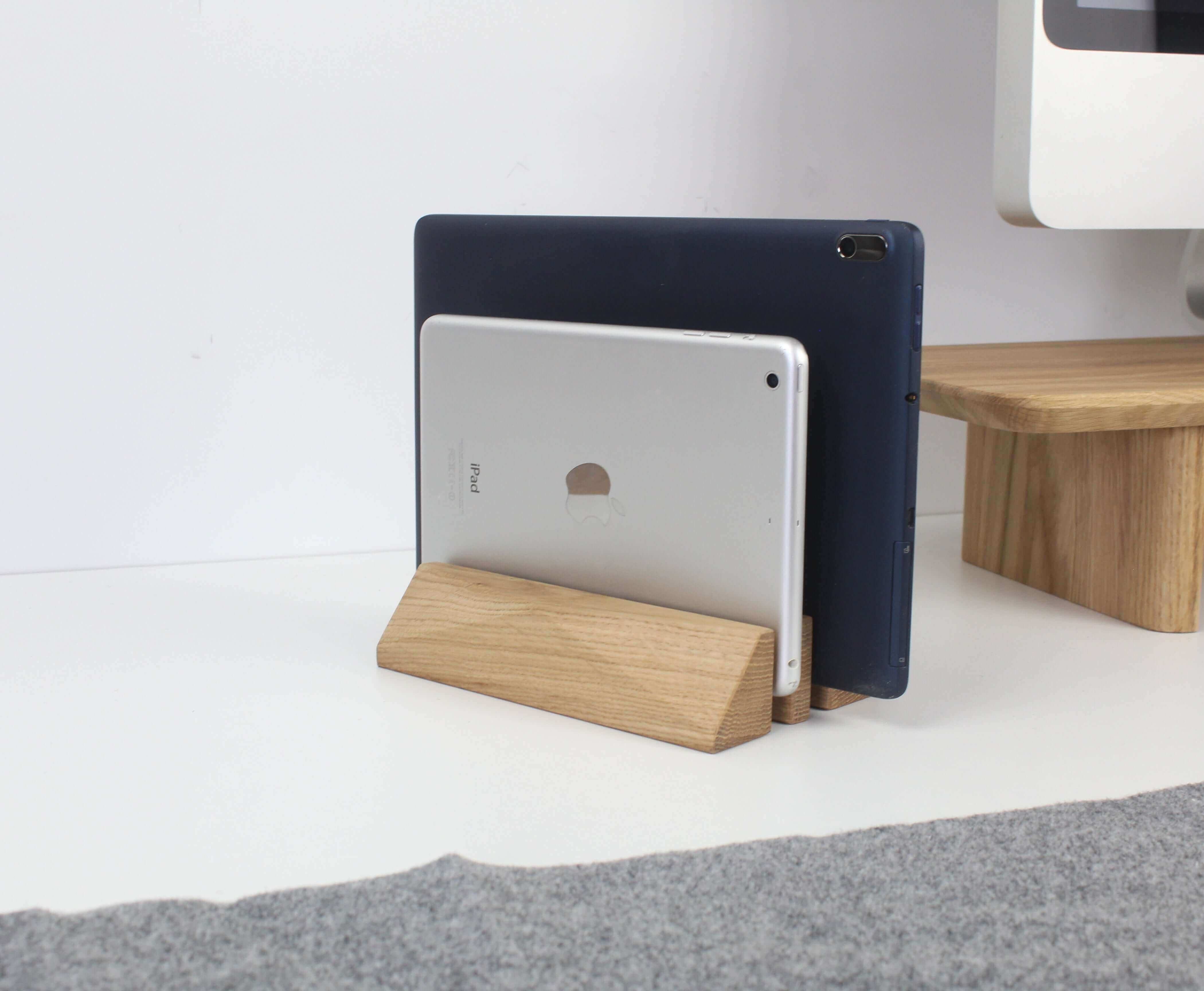 Dual laptop stand in oak showcasing two tablets neatly organized on a minimalist desk surface, enhancing workspace elegance.