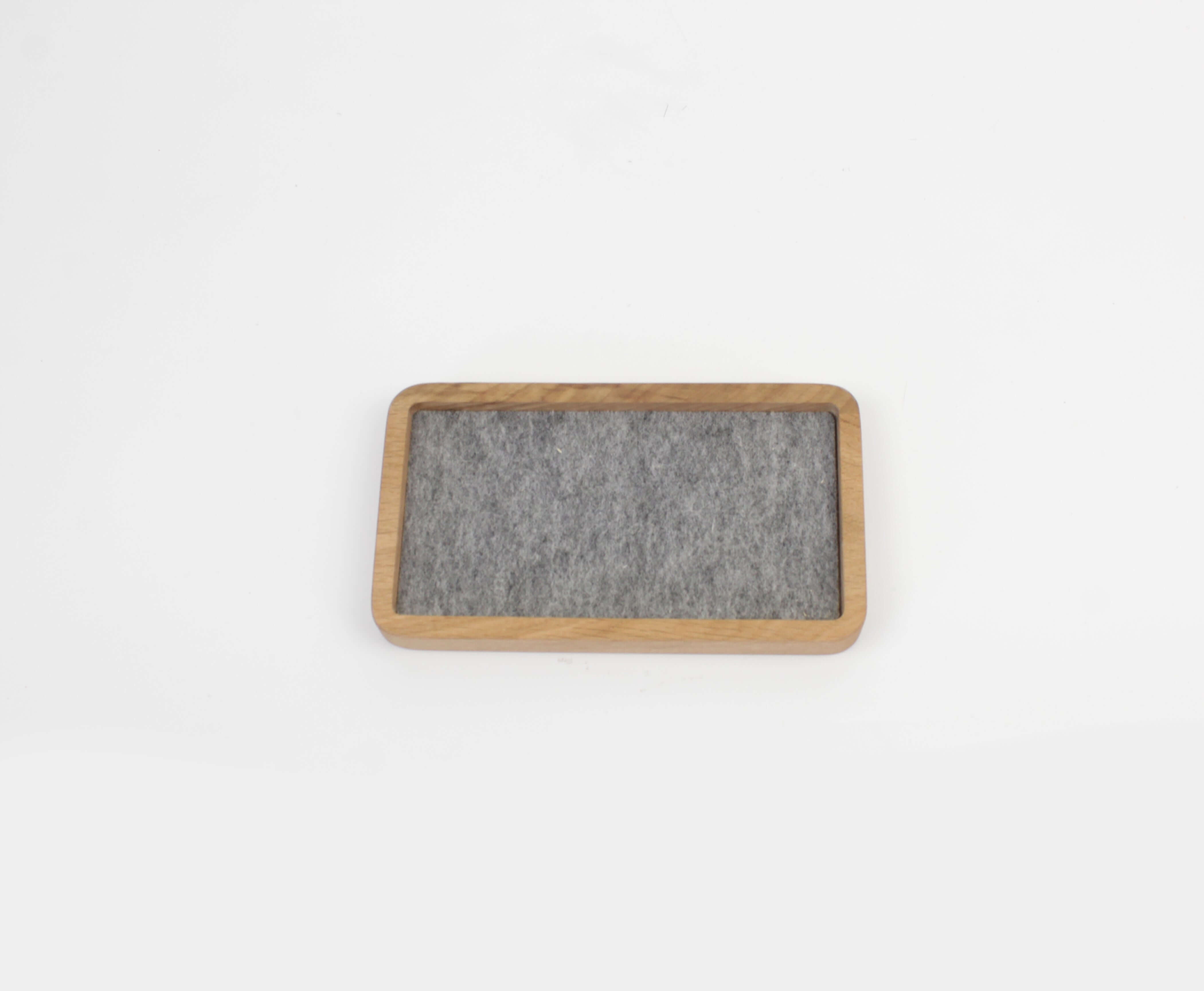 Catch All Tray in oak with gray felt interior, perfect for desk organization and small accessories.