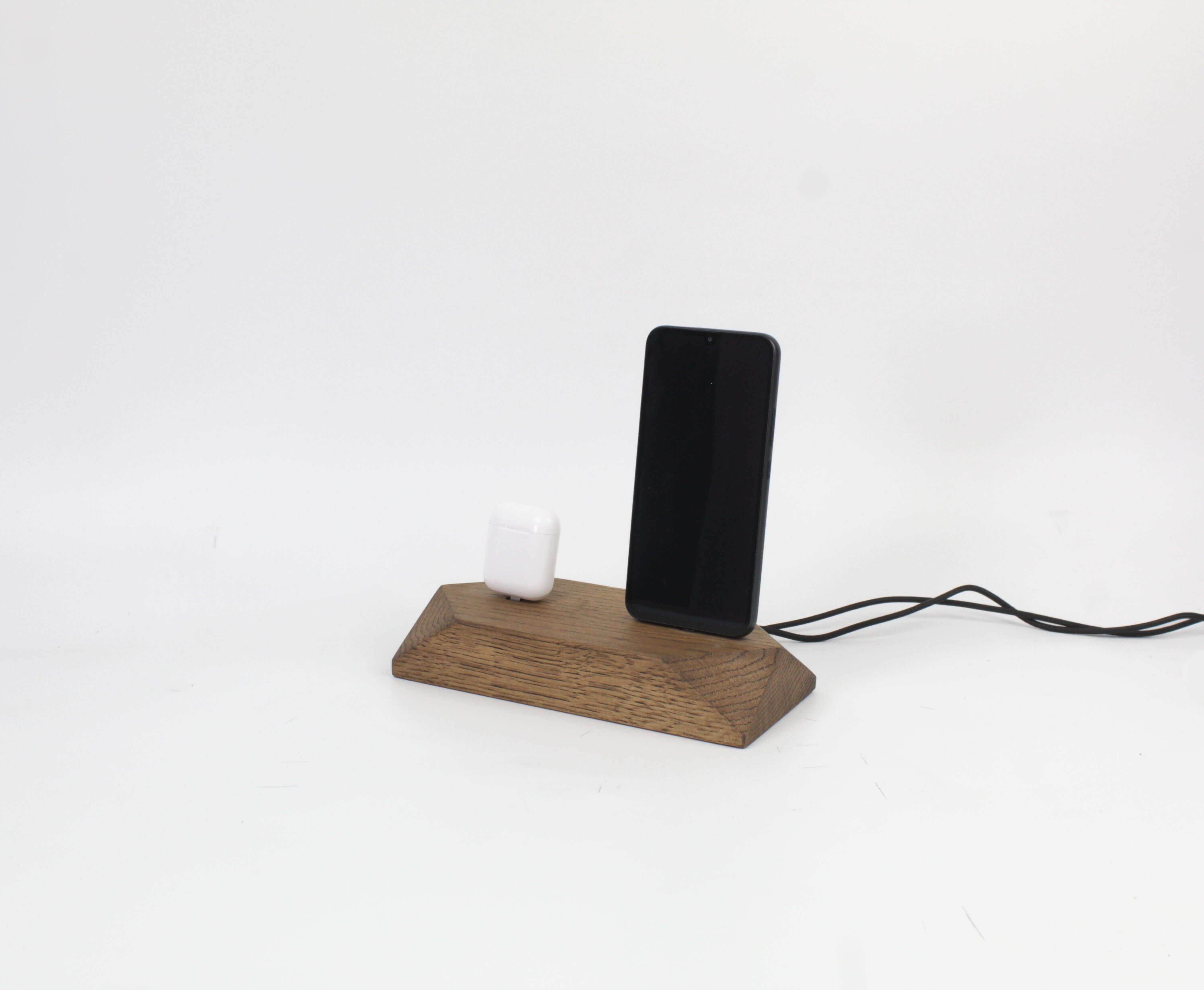 Dual Phone Dock in Brown Oak for iPhone and headphones, a stylish charging station to eliminate cable clutter.