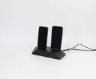 Dual Phone Dock in stained black oak for charging two devices simultaneously, reducing cable clutter on your desk.