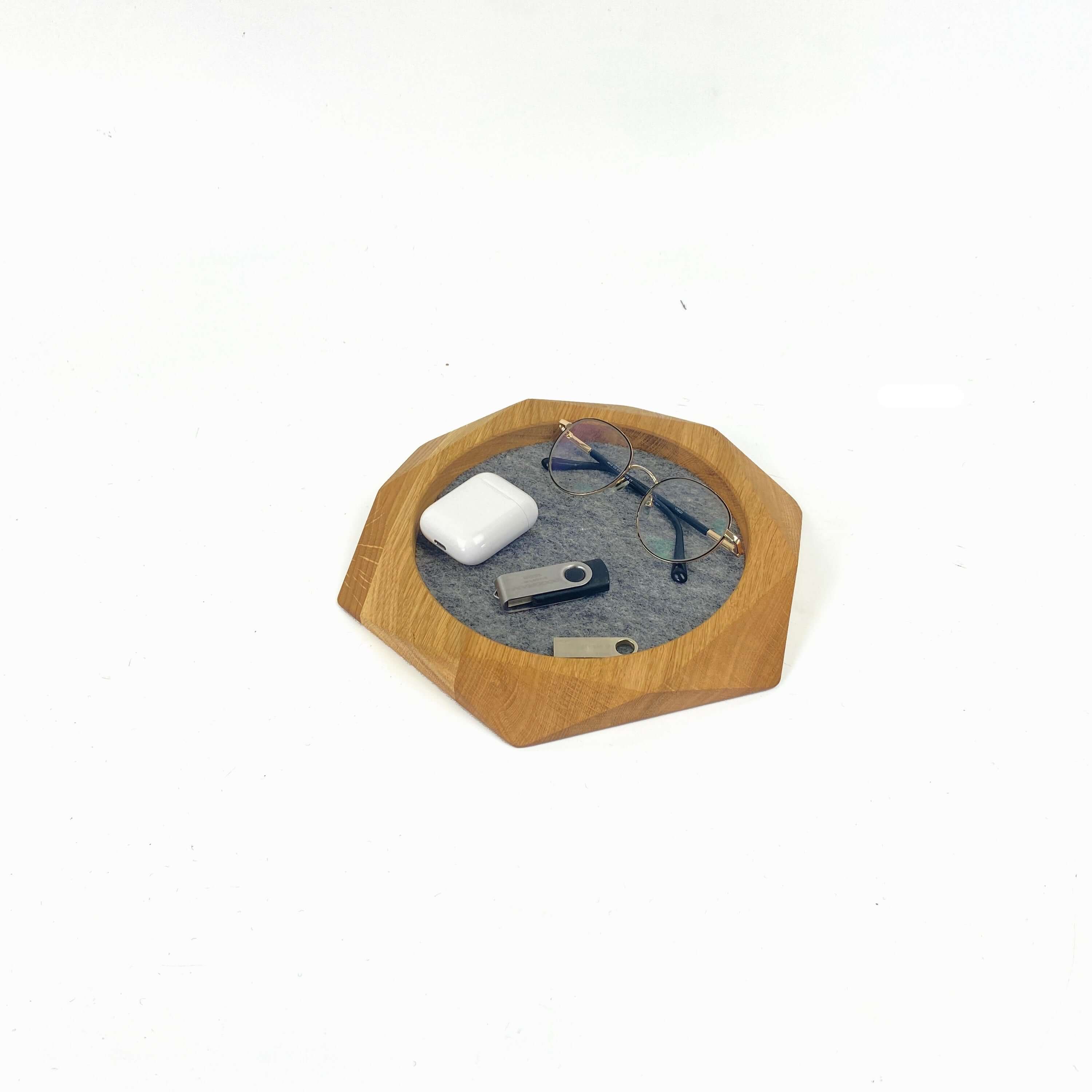 Geometric Wooden Tray displaying glasses, a USB drive, and AirPods, organized on soft felt for a stylish touch.