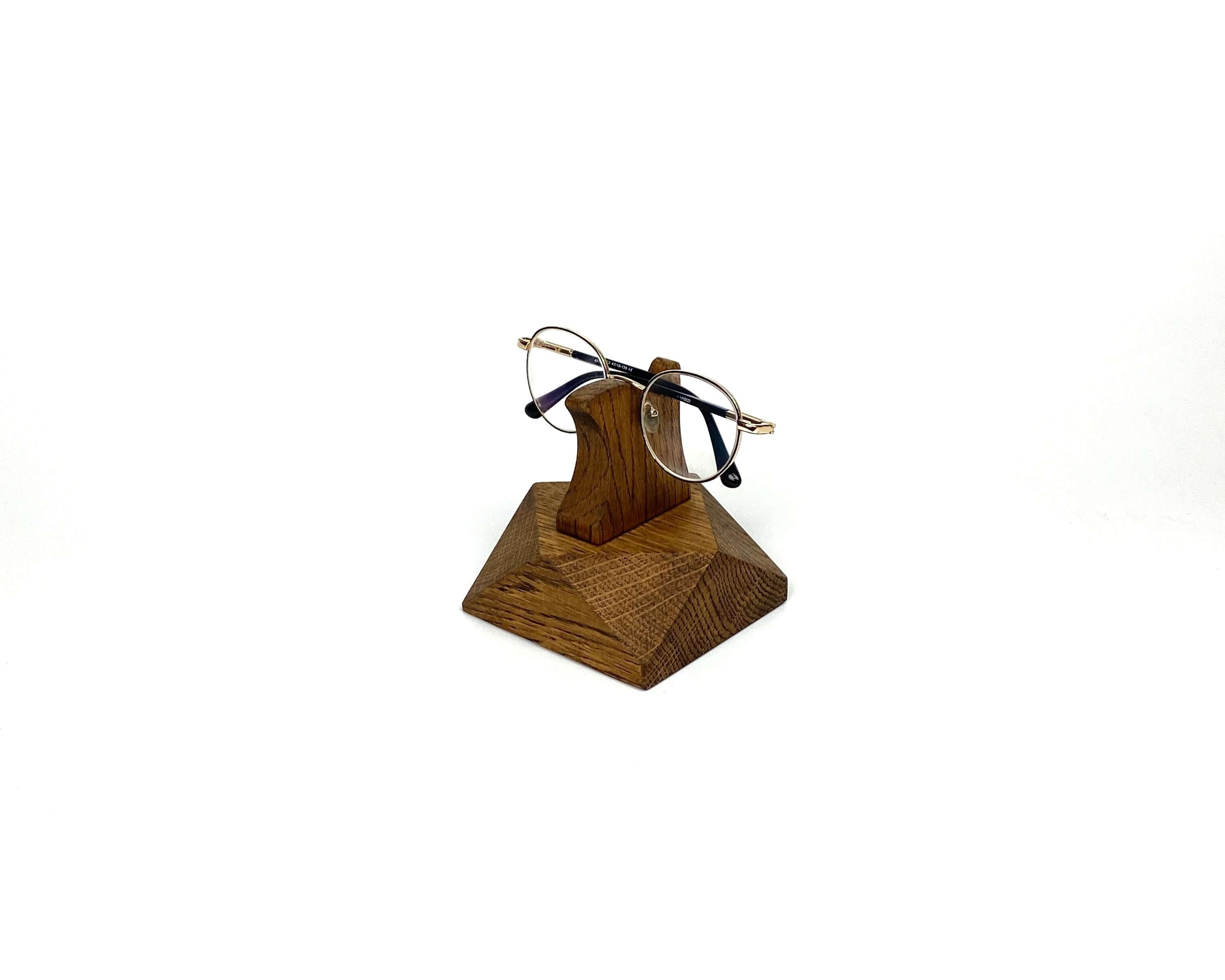 Eyeglasses Stand made from brown oak wood, elegantly displaying glasses on a desk or nightstand.