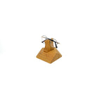 Handcrafted wooden eyeglasses stand holding stylish glasses, perfect for desk or nightstand organization.