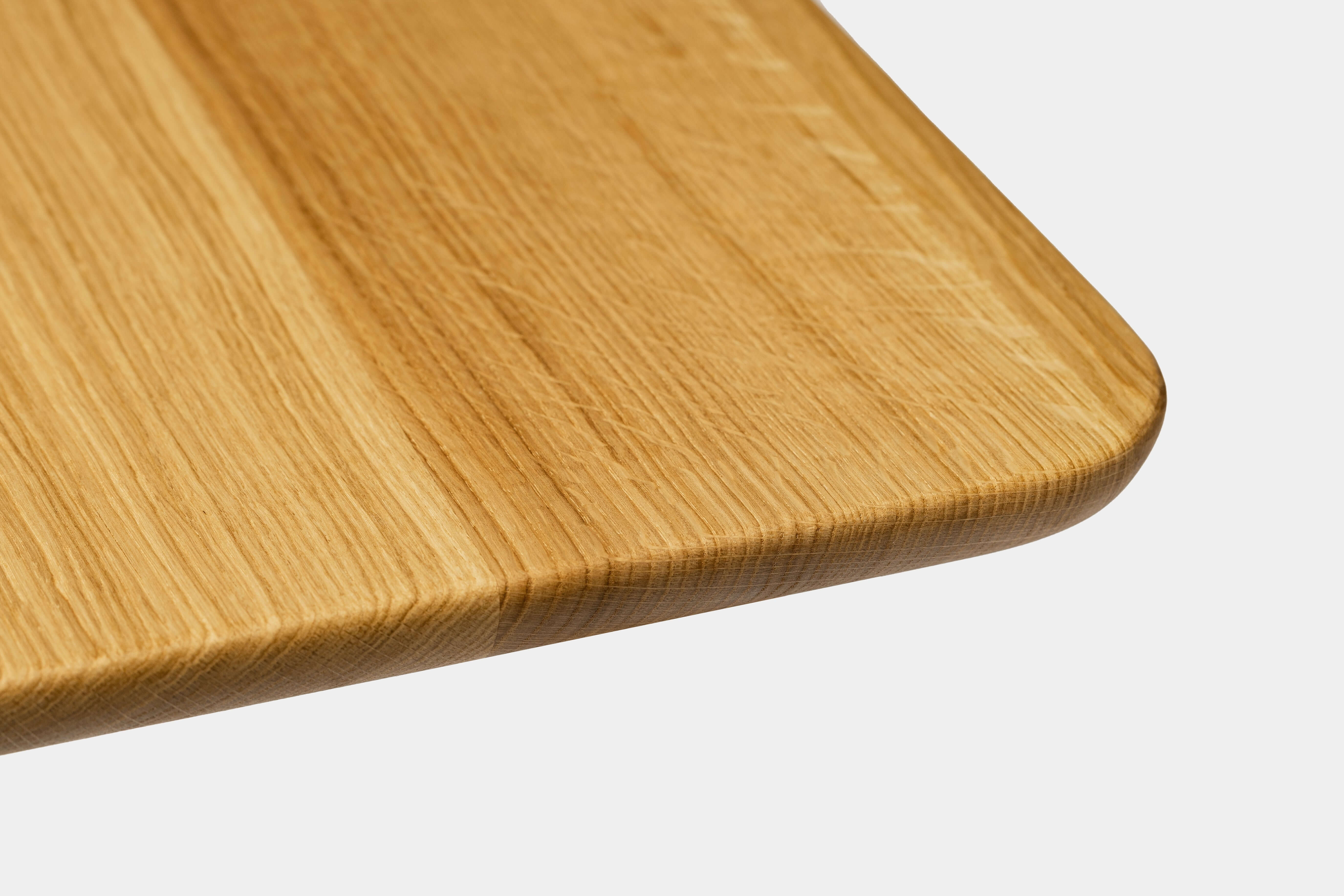 Close-up of a Wooden Table Top showcasing its natural grain and smooth edges.