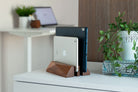 Dual Laptop Dock - Walnut holding two devices in a stylish workspace, showcasing minimalist design and organization.