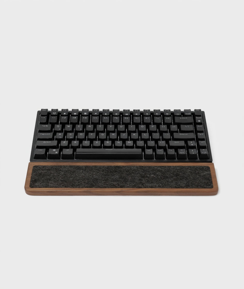 Keyboard Wrist Rest made of walnut wood with black mechanical keyboard on top, providing ergonomic support.