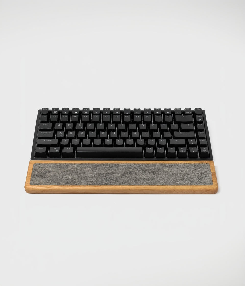 Keyboard Wrist Rest made of oak wood paired with a black mechanical keyboard for ergonomic typing support.