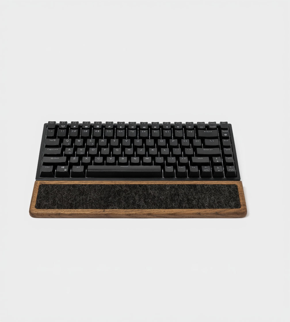 Keyboard Wrist Rest - Brown Oak positioned under a black mechanical keyboard, offering ergonomic support.
