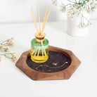 Geometric Wooden Tray made from walnut wood with merino wool felt, used for organizing jewelry and accessories.